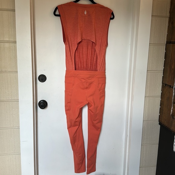 Free people MOVEMENT OFF TO THE RACES JUMPSUIT Orange xs - Picture 6 of 7